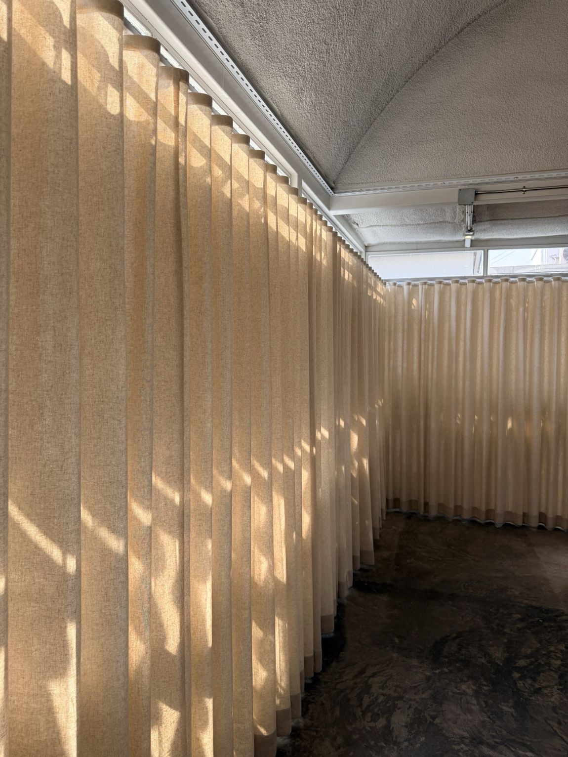 Hospitality — Sheer linen along a corridor